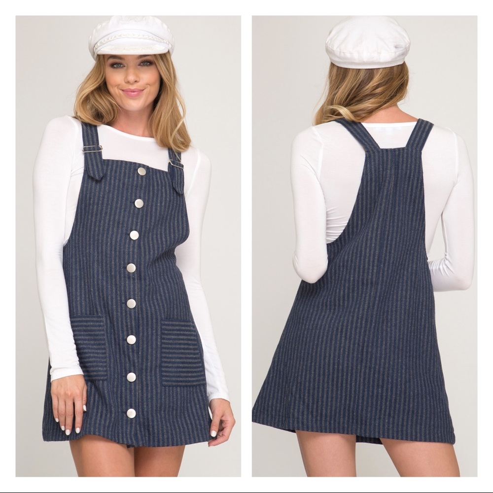 Navy color mini skirt overall. Adjustable strap.